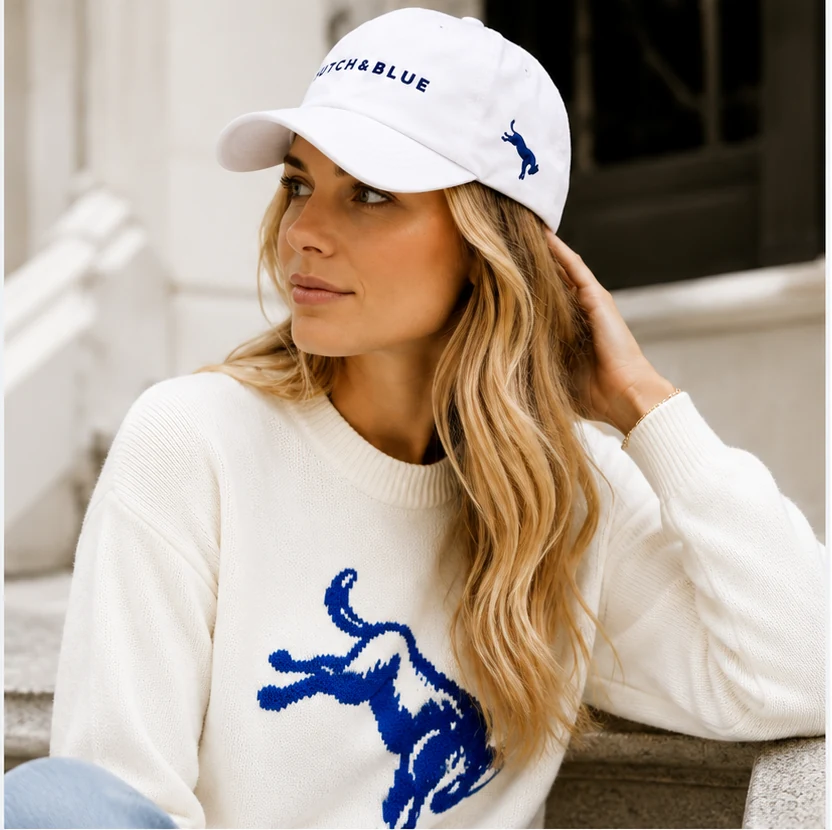 White Hutch and Blue dad hat worn by model